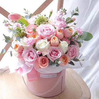 Two dozen rose in gift bucket.